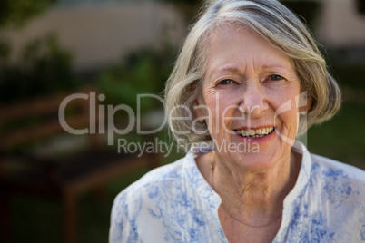 Portrait of happy senior woman at park