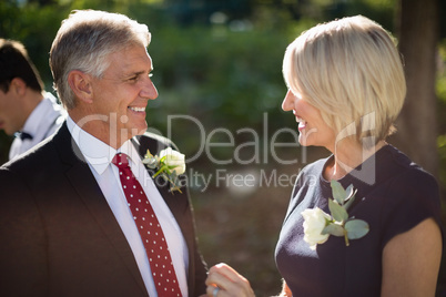 Happy couple interacting with each other in park