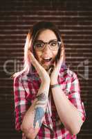Portrait of shocked woman in spectacles