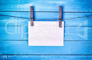 White paper envelope hanging on a rope