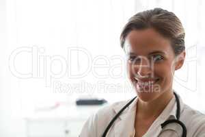 Portrait of female doctor standing in nursing home