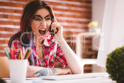 Smiling executive talking on mobile phone