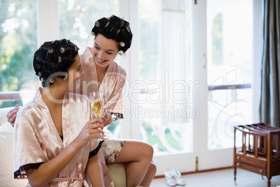 Smiling women having a glasses of champagne