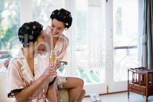 Smiling women having a glasses of champagne