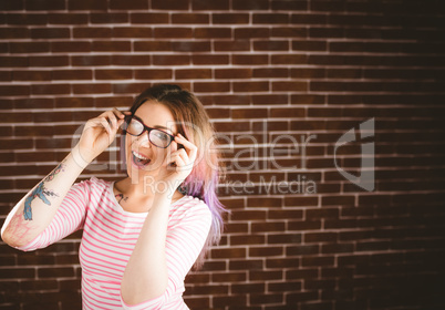 Portrait of smiling woman holding spectacles