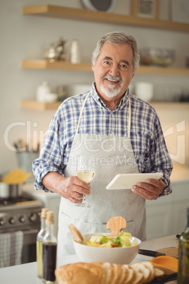 Senior man using digital tablet