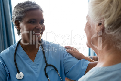 Nurse talking to senior patient in retirement home