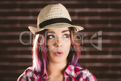 Thoughtful woman in hat