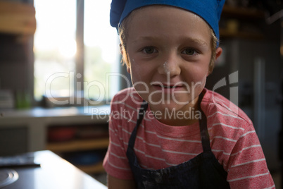 Portrait of cute boy in kitchen