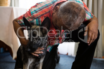 Man petting dog at nursing home