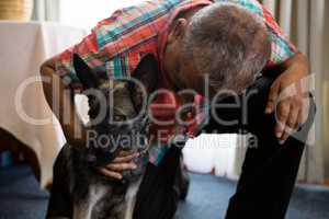 Man petting dog at nursing home