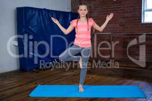 Portrait of teenage girl practicing yoga