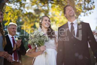 Happy couple walking hand in hand