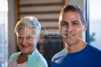 Smiling senior woman standing in hospital