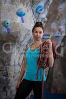 Woman holding rope in fitness studio