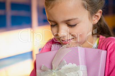 Birthday girl holding gift boxes
