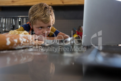 Boy looking at laptop