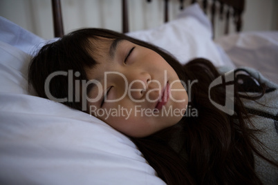 Girl sleeping on bed