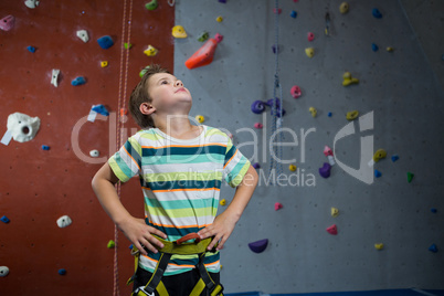 Boy standing with hands on hip in fitness studio