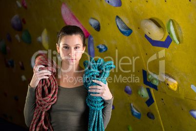 Happy woman with rope in fitness studio