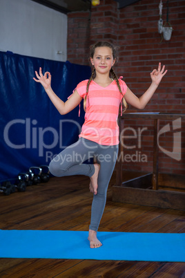 Portrait of teenage girl practicing yoga