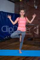 Portrait of teenage girl practicing yoga