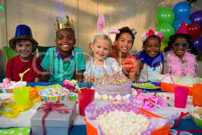 Portrait of smiling kids at table