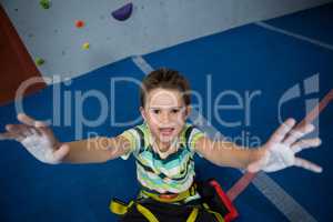 Boy showing powder on hands in studio