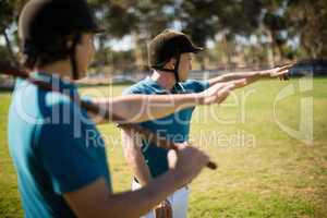 Tow male jockey talking to each other