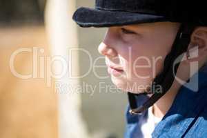 Girl sitting in the ranch on a sunny day