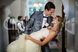 Wedding couple dancing in hall