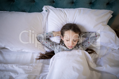 Girl sleeping on bed in bedroom