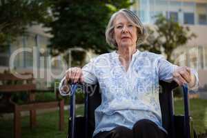 Portrait of senior woman sitting on wheelchair