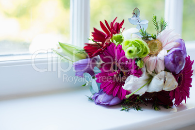 Bouquet of flower kept on window sill