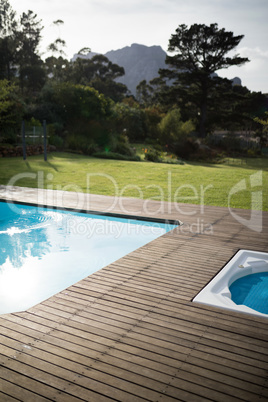 Swimming pool in the front yard of house