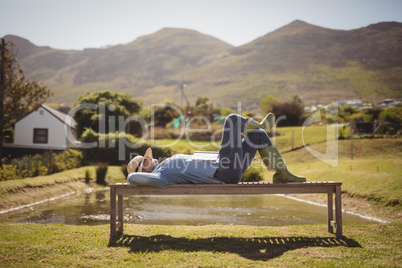 Senior woman sleeping on the park bench