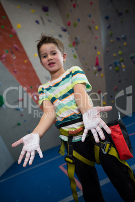 Boy showing powder on hands in studio