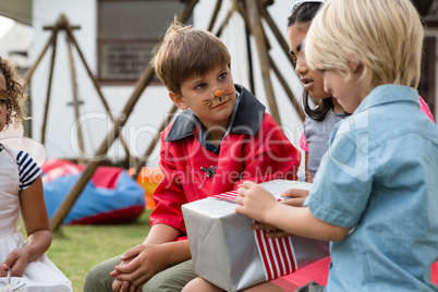 Friends taking while sitting in yard