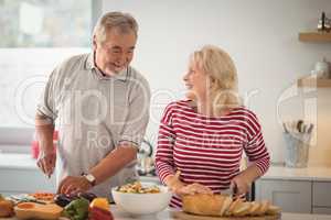 Senior couple preparing meal