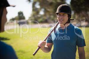 Tow male jockey talking to each other