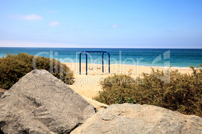 Swings on the sand at San Clemente State Beach