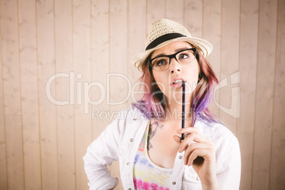 Thoughtful woman holding notepad and pen Thoughtful woman holding notepad and pen