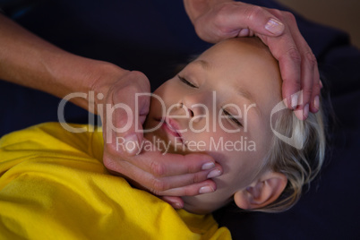 Female doctor examining a little girl
