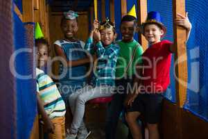 Portrait of smiling children in jungle gym