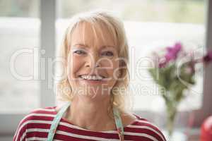 Smiling senior woman looking at camera