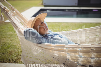 Senior woman relaxing on hammock