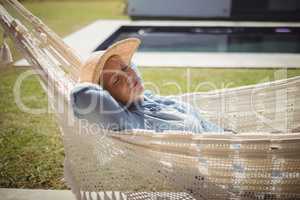 Senior woman relaxing on hammock