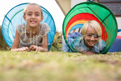 Portrait of children in tent tunnel