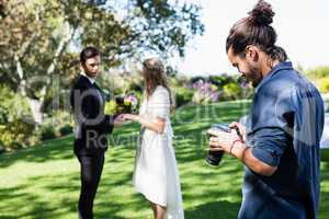 Photographer reviewing photographs on digital camera