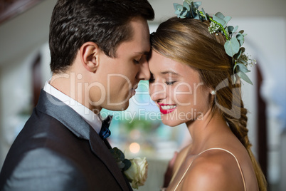 Wedding couple standing face to face